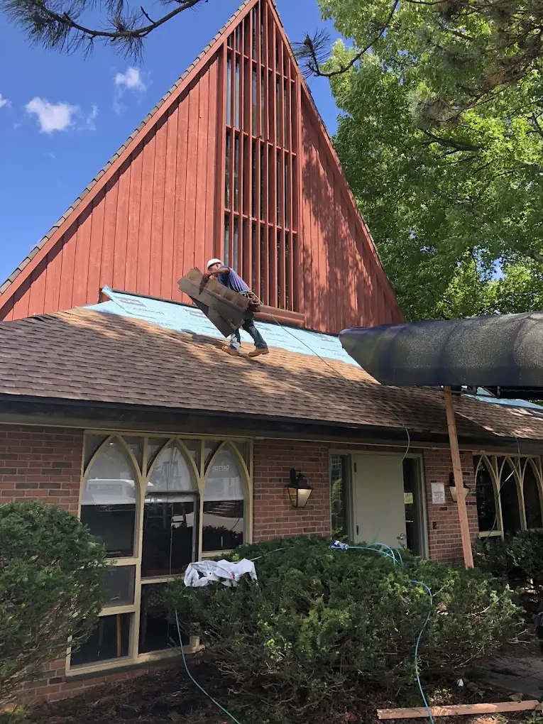 American Sons Roofing crew working on a steep roof
