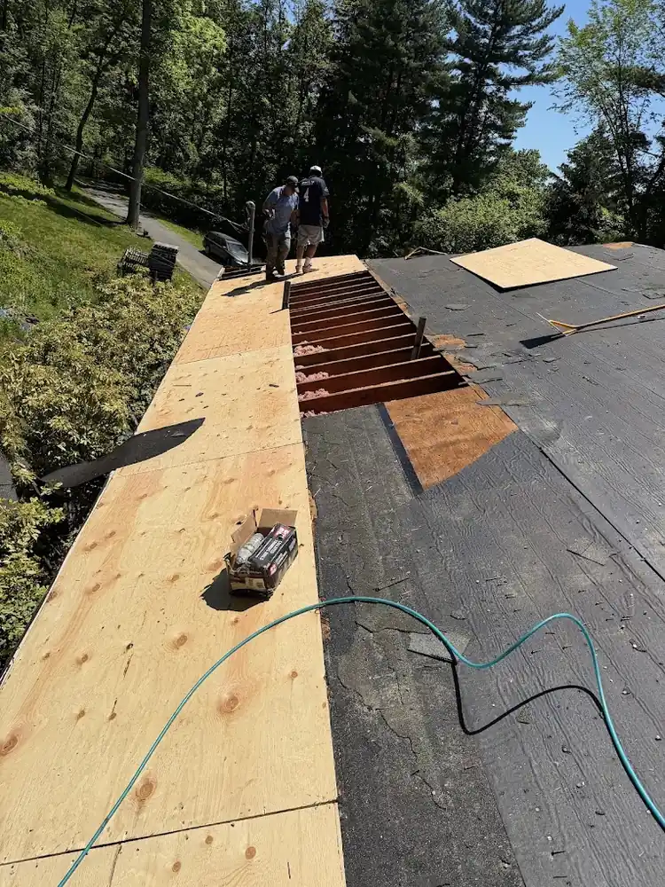 American Sons Roofing crew replacing roof decking